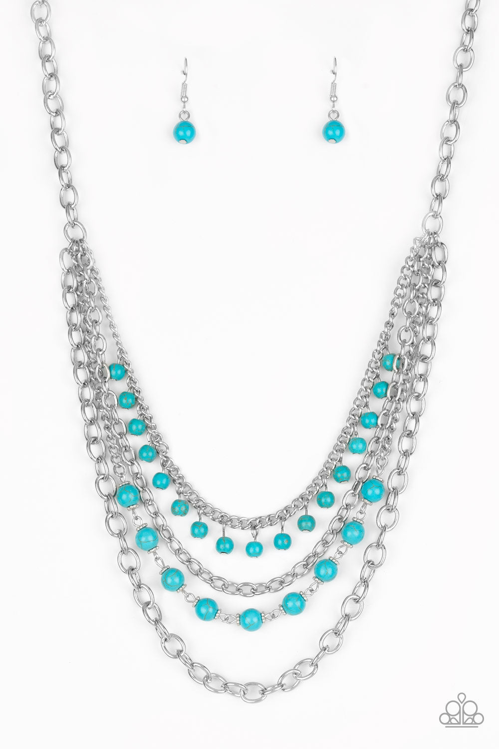 Featuring refreshing turquoise stone accents, mismatched silver chains layer below the collar for a seasonal look.