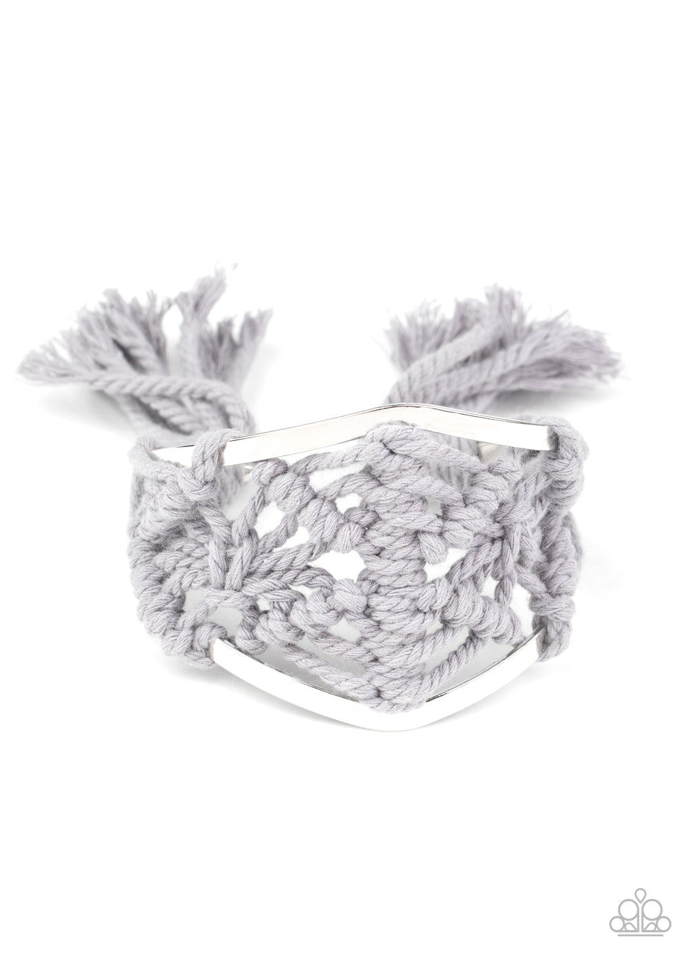 Ash cording decoratively knots and weaves around an airy silver cuff for a macramé inspired look