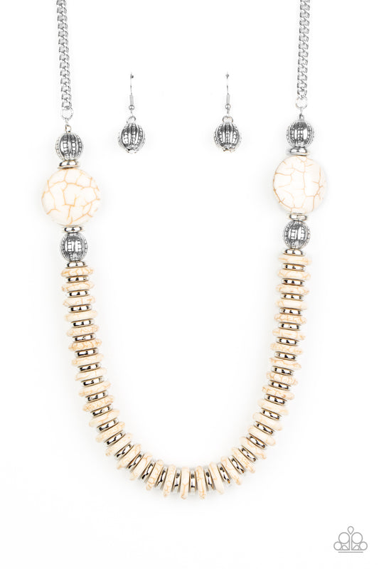 Flanked by ornate silver beads, two oversized white stones give way to an alternating strand of shiny silver and refreshing white stone discs for an authentically artisan inspired look below the collar.