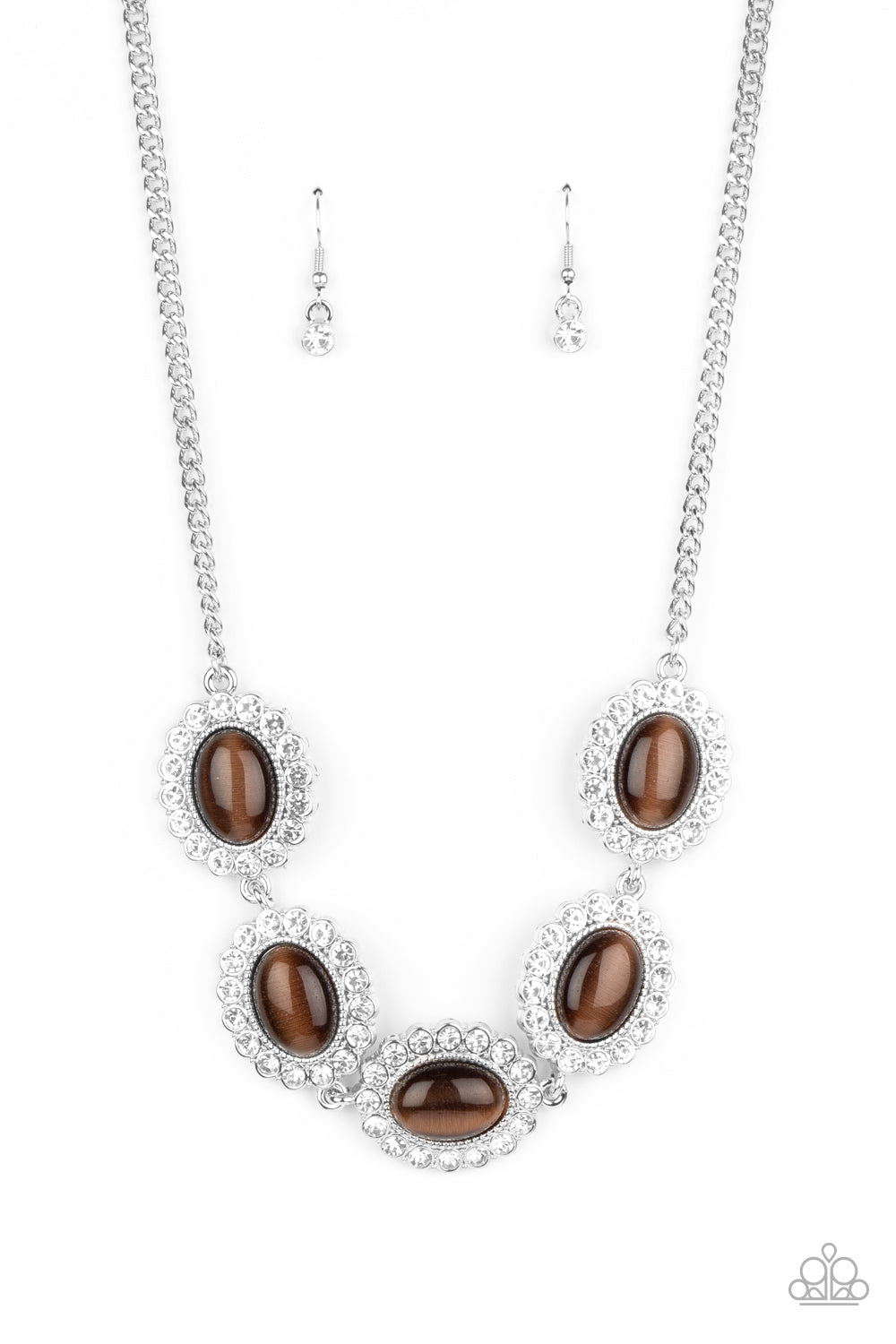 Dotted with glowing brown cat's eye stone centers, glassy white rhinestone encrusted frames glamorously link below the collar in a sparkly statement-making fashion.