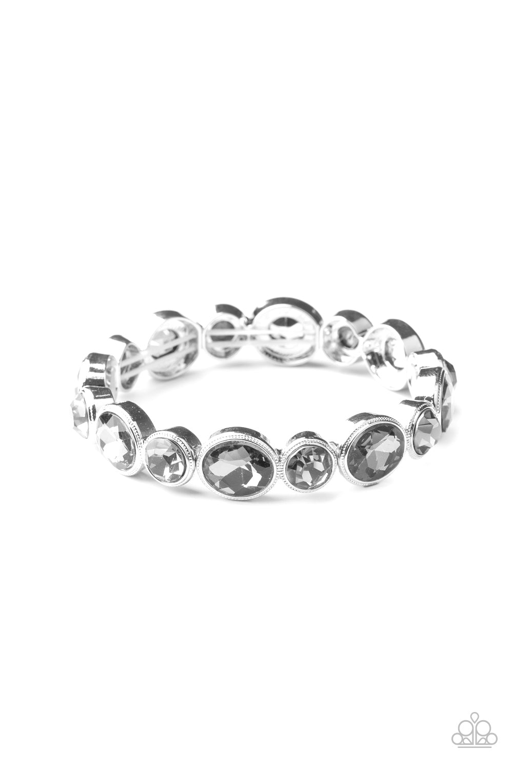 Encased in sleek silver frames, oval and round smoky rhinestones alternate along a stretchy band around the wrist for a timeless look.